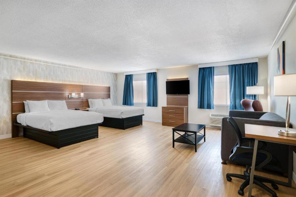 Large Queen Room with Two Queen Beds, Full Kitchen, Living Area and Sofa Bed - Non-Smoking interior